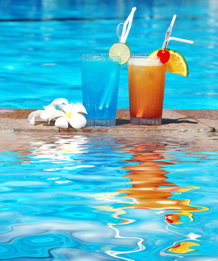 Cocktails near the swimming pool with reflection